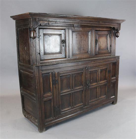 A 17th century oak court cupboard, W.5ft 4in. D.1ft 10in. H.4ft 9in.